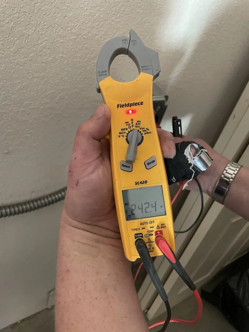 Voltage testing with clamp meter during Aluminum Wiring Replacement in South Portland